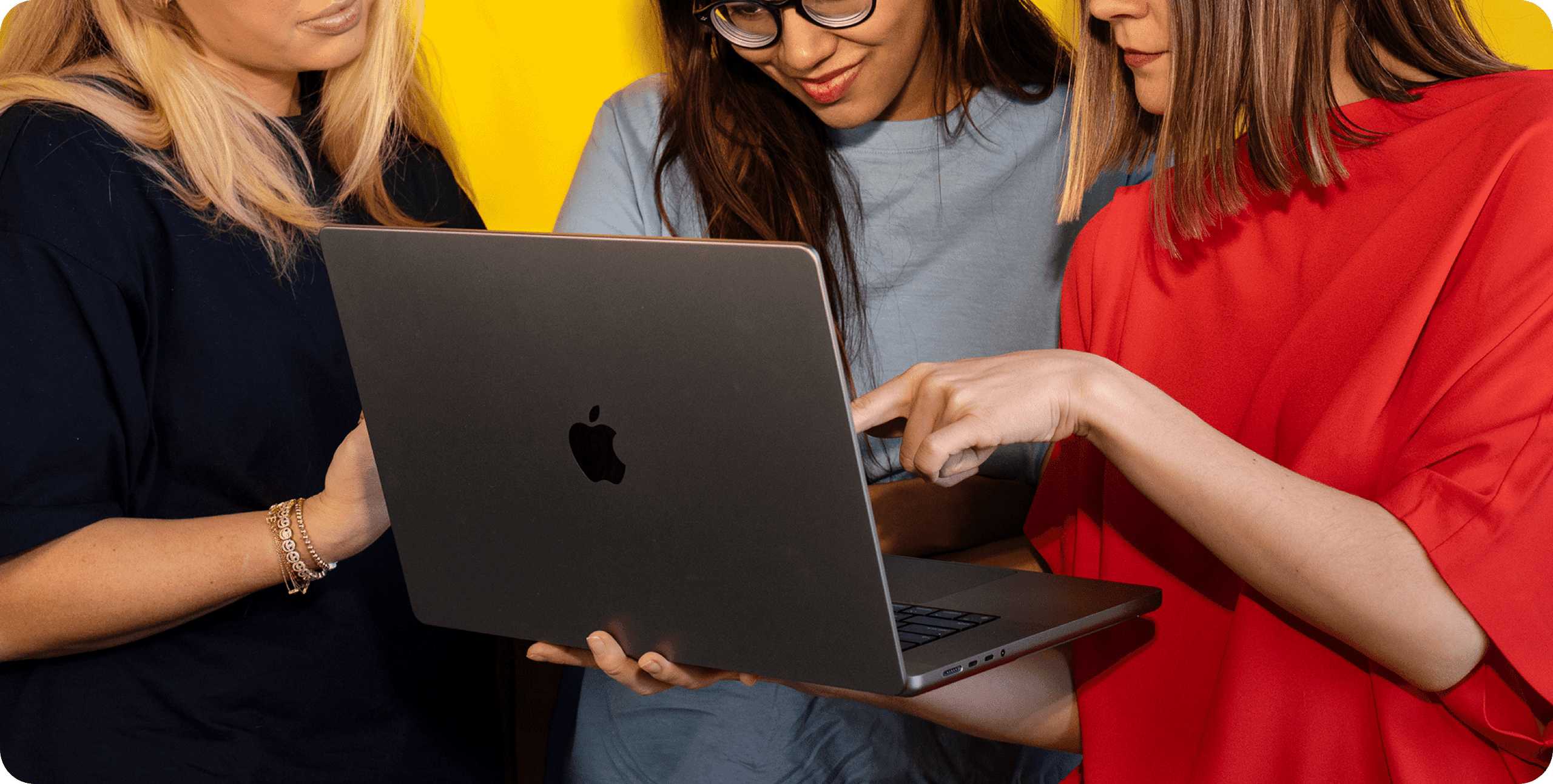 Hope, Ishani, and Oxana around a computer